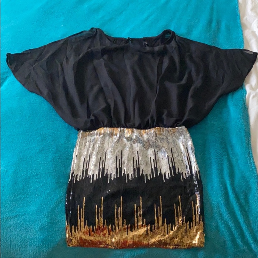 Dress with black too and sequence skirt